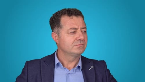 Man Looks Around Anxiously in Studio Mid Shot