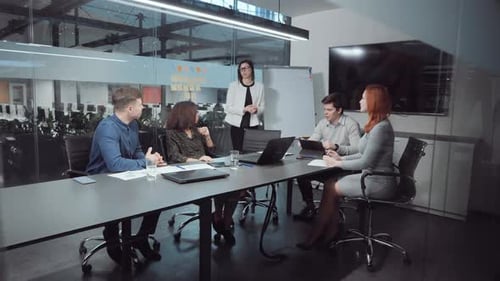 Manager Reporting During Business Meeting in Office