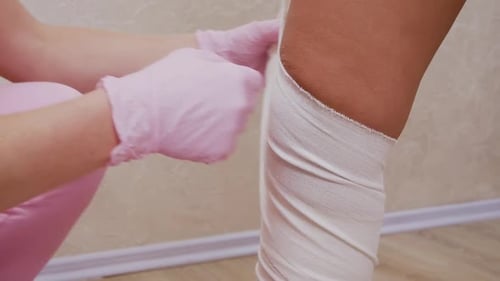 Wrapping Leg with Bandage in Healthcare Setting