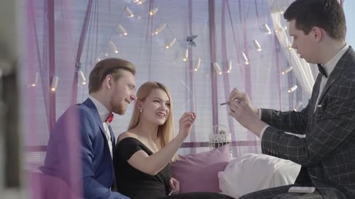 Young Illusionist Making Magic Trick with Cards