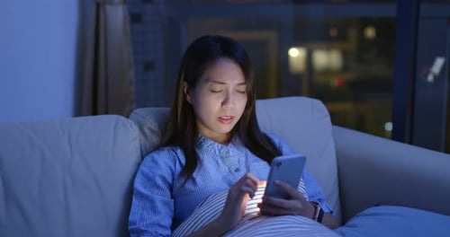 Woman use of mobile phone at night and feeling eye pain and dry