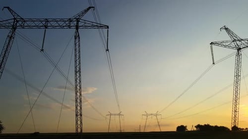 Power Lines at Sunset over Rural Landscape