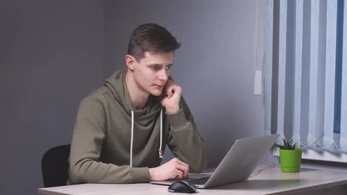 Young Manager Works at Night