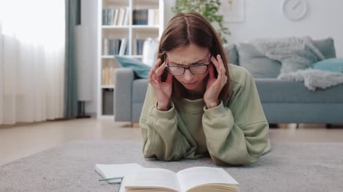 Woman Feeling Tired After Studying at Home