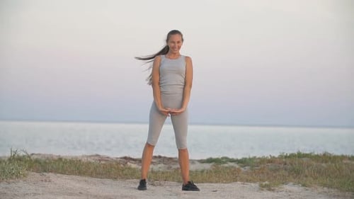 Girl Is Training on the Beach