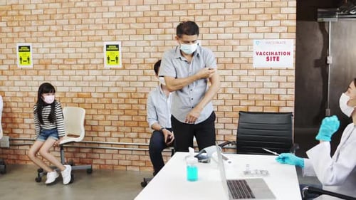 Adult Receiving Vaccine at Vaccination Site