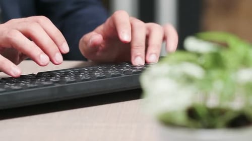 Dolly, Close Up Shot, of Businessman Hands Typing on Keyboard