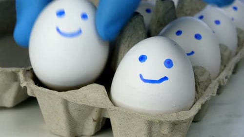 Eggs with Smiley Faces Taken from Carton
