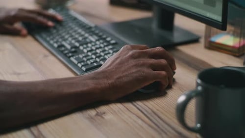 Crop Black Guy Using Computer