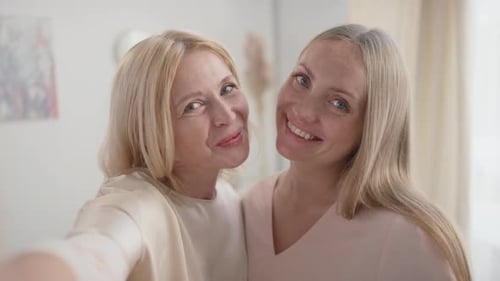 Two Smiling Women Take a Selfie Together