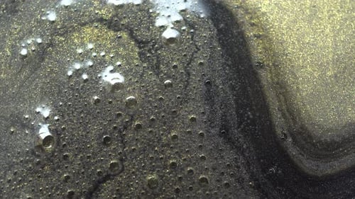 Abstract Gold and Black Liquid with Bubbles