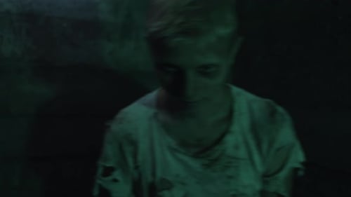 Close-Up of Distressed Child in Dark Lighting