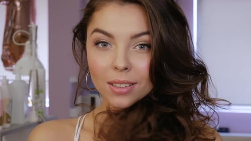 Pretty Woman Smiles and Poses for the Camera