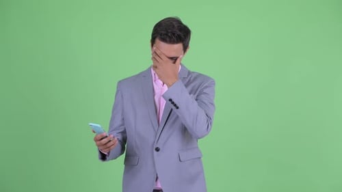 Man Disappointed by Phone, Gives Thumbs Down