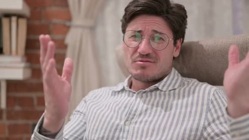 Man Reacts with Shock and Frustration