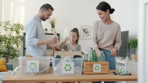 Family Sorting Recycling at Home Together