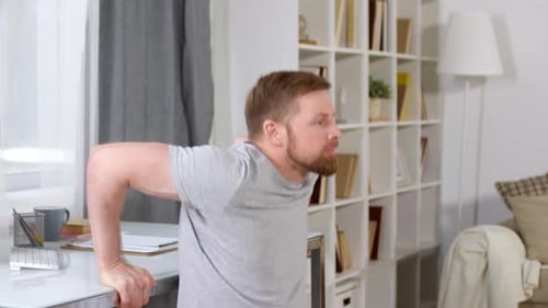 Man Exercising with Tricep Dips at Home