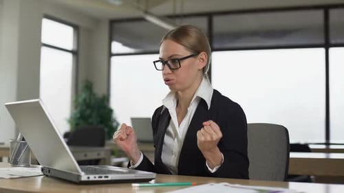Woman Meditating at Office Desk, Reducing Work Stress and Irritation, Relaxing