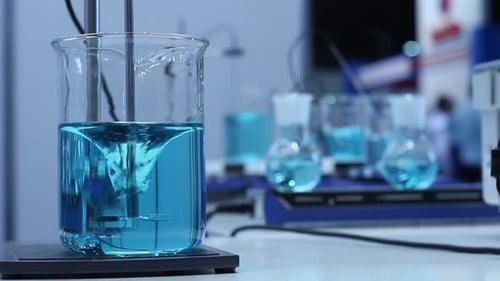 Blue Liquid Mixing in a Glass Beaker