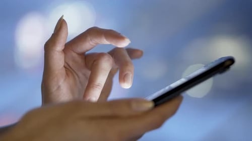 Close Up of Woman's Hands Using Smartphone
