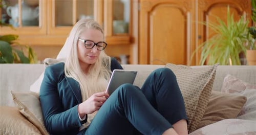 Businesswoman Using Digital Tablet In Office
