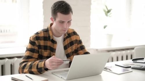 Man Using Laptop, Credit Card for Online Shopping