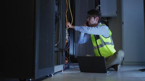 IT Engineer Working in Server Room
