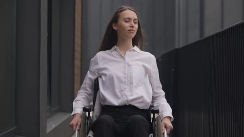 Confident Woman in Wheelchair on City Street