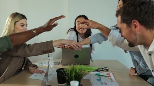 Teamwork Success Office Workers Fold Their Hands Celebrating the Launch of a New Project