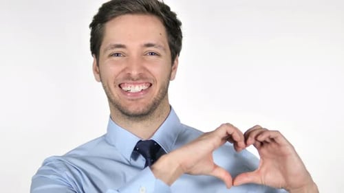 Smiling Man Makes Heart Shape with Hands