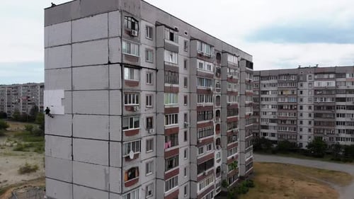 Industrial Alpinism. Aerial View. Work on Outer Insulate Building with Styrofoam