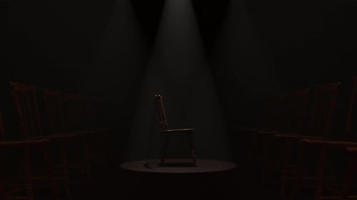Dramatic Spotlighted Rotating Wooden Chair on Dark Stage