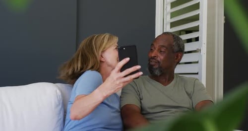 Woman and Man Taking a Selfie at Home