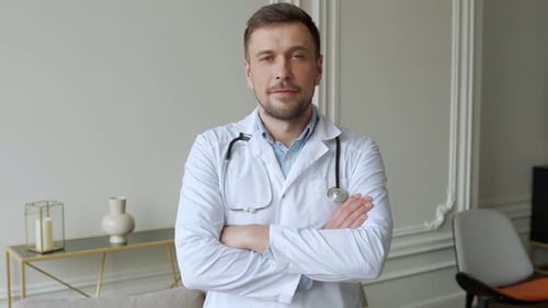 Confident Doctor with Stethoscope Poses Indoors