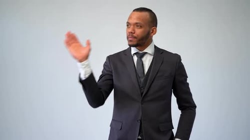 Man Gesturing at Invisible Touchscreen Display