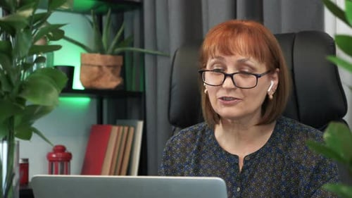 Woman on Video Conference in Home Office