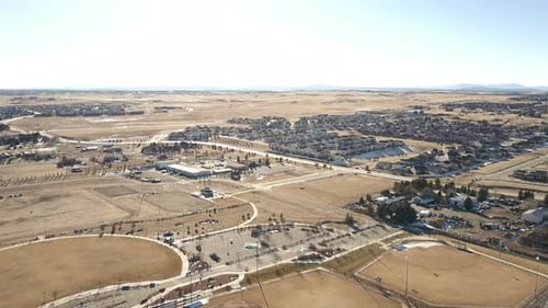 Aerial View of Suburban Community Next to Rural Land