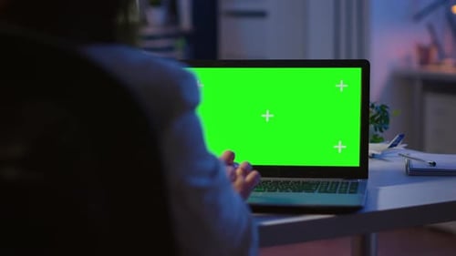 Close Up of Freelancer Typing on Laptop with Green Screen Overtime