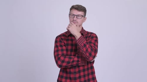 Man with Glasses Thinking and Smiling