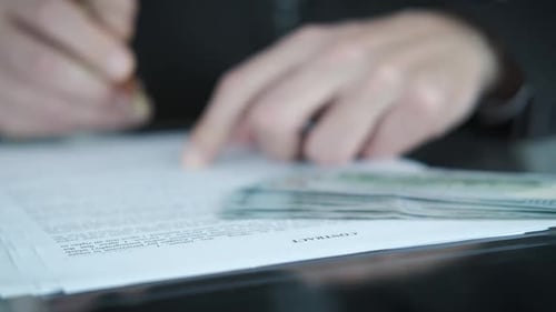 Signing a contract.