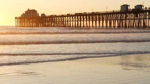 Wooden Pier on Piles Silhouette at Sunset California USA Oceanside