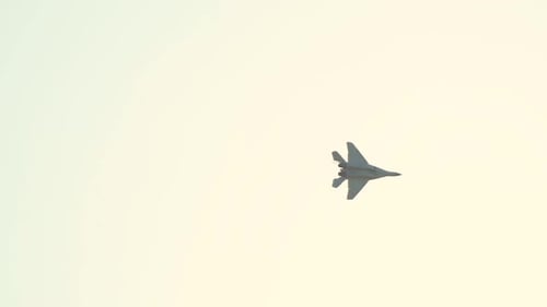 Fighter Jet Flying in a Clear Sky