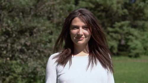 Attractive Girl Posing in the Park in Sunny Weather