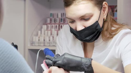Cleaning the Nail of the Hand with a Milling Machine