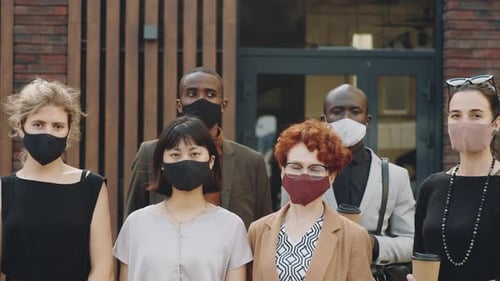 Business Professionals Wearing Face Masks Stand Together
