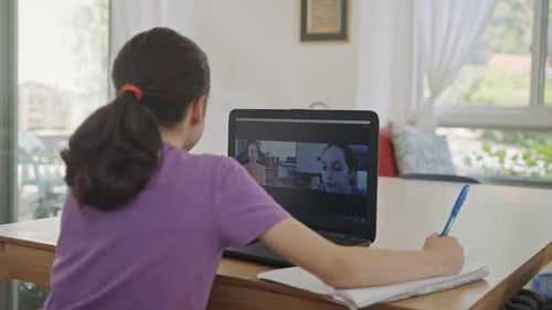 Child Attending Class Remotely at Home