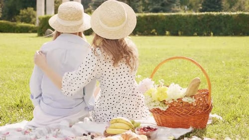 Two Friends Enjoying Sunny Picnic in the Park