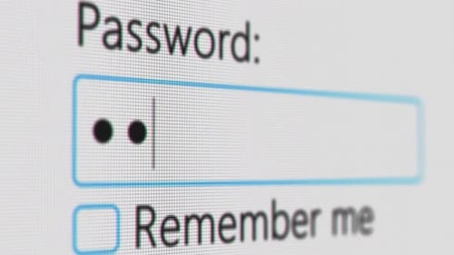 Password Entry. Someone Entering Their Password on a Computer Screen. Log in To Your Account. Typing
