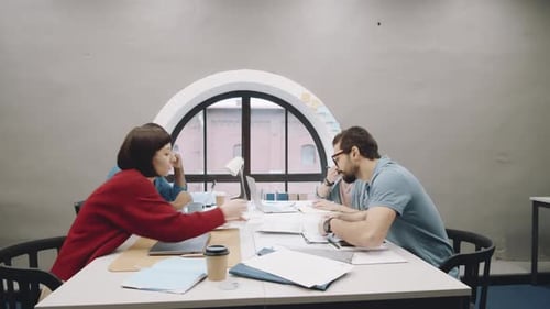 Business Colleagues Working Together at Office Table