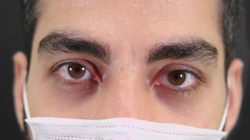 Close Up of Man Wearing Medical Face Mask